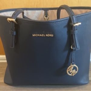 Navy blue Michael Kors purse.